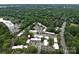 Aerial view highlighting the community's proximity to lush surroundings at 1708 Roxborough Rd # C, Charlotte, NC 28211