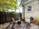 Private backyard featuring a fire pit and outdoor seating with stone landscaping at 1708 Roxborough Rd # C, Charlotte, NC 28211