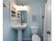 Updated bathroom features pedestal sink, white tile shower, and modern lighting at 1708 Roxborough Rd # C, Charlotte, NC 28211