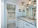 Bright bathroom with granite countertop, ample storage, and view of the bathtub at 1708 Roxborough Rd # C, Charlotte, NC 28211