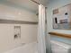 Clean bathroom bathtub with white subway tile and a shower niche at 1708 Roxborough Rd # C, Charlotte, NC 28211