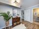 Cozy entryway featuring hardwood floors, neutral paint, charming decor, and a bright, open feel at 1708 Roxborough Rd # C, Charlotte, NC 28211