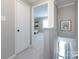 Hallway with a door leading to a room with a white couch at 1708 Roxborough Rd # C, Charlotte, NC 28211