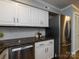 Modern kitchen featuring stainless steel appliances, granite countertops, white cabinets and subway tile backsplash at 1708 Roxborough Rd # C, Charlotte, NC 28211
