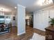 Spacious living area showcasing a dining table, access to the kitchen, hardwood flooring, and neutral paint at 1708 Roxborough Rd # C, Charlotte, NC 28211