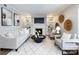 Well-lit living room featuring a fireplace, built-in shelving, and neutral furnishings at 1708 Roxborough Rd # C, Charlotte, NC 28211