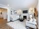 Cozy living room with a fireplace, built-in shelving, neutral decor, and natural light at 1708 Roxborough Rd # C, Charlotte, NC 28211