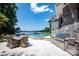 Enjoy this backyard oasis with a pool, hot tub, outdoor kitchen, lake views, and patio seating at 175 Rehoboth Ln, Mooresville, NC 28117