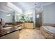 Bathroom with dual vanities, soaking tub, and a separate glass shower at 175 Rehoboth Ln, Mooresville, NC 28117
