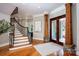 Foyer with staircase, hardwood floors, and a wood and glass front door at 175 Rehoboth Ln, Mooresville, NC 28117
