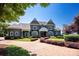 Stately gray two-story home showcasing beautiful landscaping and a stone driveway leading up to the inviting front entrance at 175 Rehoboth Ln, Mooresville, NC 28117