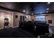Experience movie nights in this home theater with tiered seating, projector, and high-quality sound system at 175 Rehoboth Ln, Mooresville, NC 28117