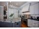 Spacious kitchen with marble island, stainless steel appliances, and white cabinets at 175 Rehoboth Ln, Mooresville, NC 28117