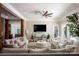 Spacious living room with multiple seating areas, natural wood accents, and views to other rooms at 175 Rehoboth Ln, Mooresville, NC 28117