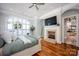 Lake view main bedroom with fireplace and hardwood floors at 175 Rehoboth Ln, Mooresville, NC 28117