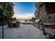 Outdoor kitchen and dining area overlooking the lake, perfect for alfresco entertaining and enjoying the views at 175 Rehoboth Ln, Mooresville, NC 28117