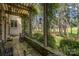 The covered patio offers stunning views of the golf course and surrounding wooded area at 177 Yadkin Falls Rd, New London, NC 28127