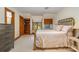 Bedroom with a brass bed frame, built-in shelving, and natural light from the window at 177 Yadkin Falls Rd, New London, NC 28127