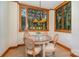 Cozy breakfast nook with lots of natural light and a lovely view at 177 Yadkin Falls Rd, New London, NC 28127