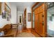 A grand foyer features hardwood floors, an ornate front door, and an adjoining hallway at 177 Yadkin Falls Rd, New London, NC 28127