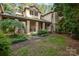 An inviting front entrance with stone columns, a brick path, and manicured landscaping at 177 Yadkin Falls Rd, New London, NC 28127