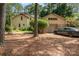 A two car garage featuring stone accents and a paved driveway at 177 Yadkin Falls Rd, New London, NC 28127