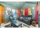 Home theater featuring black leather seating, movie posters, and custom lighting at 177 Yadkin Falls Rd, New London, NC 28127