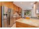 Kitchen with stainless steel appliances, island and wooden cabinets at 177 Yadkin Falls Rd, New London, NC 28127