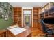 Spacious office featuring custom wood shelving and a green accent wall at 177 Yadkin Falls Rd, New London, NC 28127