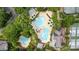 Aerial view of a pool area with two pools, a slide, and umbrella-covered lounge chairs at 177 Yadkin Falls Rd, New London, NC 28127
