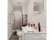 Bathroom with modern fixtures, a shower with patterned curtain, and laminate floors at 201 Oakland Dr, Lowell, NC 28098