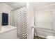 Bathroom featuring a white vanity, a sink, and a shower with a chevron shower curtain at 201 Oakland Dr, Lowell, NC 28098