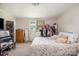 Carpeted bedroom featuring a window, dresser, and queen size bed at 201 Oakland Dr, Lowell, NC 28098