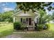 Charming single-story home with a welcoming front porch and well-maintained lawn at 201 Oakland Dr, Lowell, NC 28098