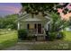 Charming single-story home with a welcoming front porch and well-maintained lawn at 201 Oakland Dr, Lowell, NC 28098