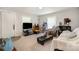 Inviting living room with neutral carpet, lots of light, and cozy furnishings at 201 Oakland Dr, Lowell, NC 28098