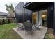 Cozy backyard patio with outdoor seating and lush landscaping at 2107 W Trade St, Charlotte, NC 28216