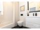 Modern bathroom featuring white subway tiles, sleek vanity, and contemporary fixtures at 2107 W Trade St, Charlotte, NC 28216