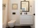 Chic bathroom with a floating vanity, modern toilet, and stylish decor at 2107 W Trade St, Charlotte, NC 28216