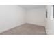 Neutral bedroom featuring plush carpet, natural light, and spacious design at 2107 W Trade St, Charlotte, NC 28216