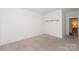 Minimalist bedroom with neutral carpet, base molding, and a bright, open feel at 2107 W Trade St, Charlotte, NC 28216