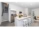 Modern kitchen with stainless steel appliances, white cabinets, and a breakfast bar at 2107 W Trade St, Charlotte, NC 28216