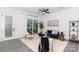 Living room with bright white walls, modern furniture, area rug, and patio door at 2107 W Trade St, Charlotte, NC 28216