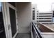 Balcony with railing providing outdoor space with views of a building and the city skyline at 230 S Tryon St # 304, Charlotte, NC 28202