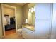 Bathroom features a granite vanity with ample cabinet space and walk-in closet at 230 S Tryon St # 304, Charlotte, NC 28202