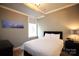 Bright bedroom with a comfortable bed, soft lighting, and a window with natural light at 230 S Tryon St # 304, Charlotte, NC 28202