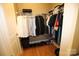 Walk-in closet with shelving, hanging rods, and organization at 230 S Tryon St # 304, Charlotte, NC 28202