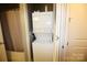 The laundry room features a stacked washer and dryer unit at 230 S Tryon St # 304, Charlotte, NC 28202