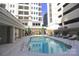 Outdoor pool with lounge chairs, and nearby landscaped courtyard area at 230 S Tryon St # 304, Charlotte, NC 28202