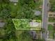 Aerial view showcases the property's boundaries surrounded by lush greenery at 2312 Tate St, Charlotte, NC 28216